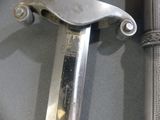 a close up of a sword on display in a case