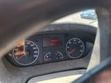 a car dashboard with a speedometer and gauges in it