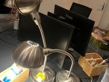 a desk with a lamp and a laptop on it
