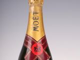 an image of a bottle of moet champagne on a white surface