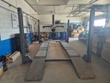 an image of a garage with a lot of work on the floor