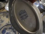 a person holding a plate with a picture on it