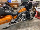 two motorcycles that are parked in a garage