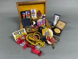 a small wooden box filled with medals and other items