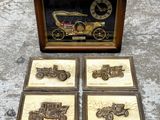 three framed pictures of antique cars and a clock in a wooden frame