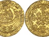 a gold coin with an image of a ship on it
