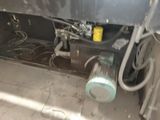 an image of a machine that is under a building
