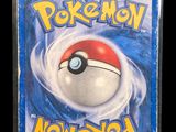 a close up of a box of pokemon cards with a red and white ball