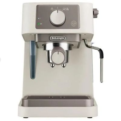 une image représentant une machine à café sur laquelle est posée une tasse