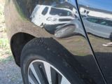 a black car parked on the side of the road