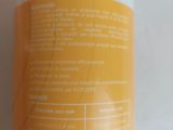 a close up of a bottle of lotion on a table