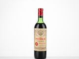 a bottle of red wine sitting on top of a table
