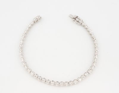 a white gold bracelet with round brilliant cut diamonds
