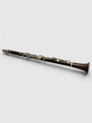 a close up of a flute on a white surface