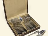 a box with a set of silver spoons and spoons in it