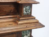 a large wooden cabinet with a clock on top of it