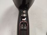 a black blow dryer sitting on top of a table