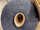 a close up of a roll of yarn in a box