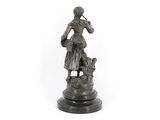 statue of a woman with a dog on a pedestal on a white background