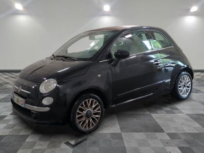 a picture of a small black car on a checkered floor