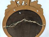 a mirror with a bird on it and a clock with a bird on it