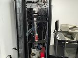 an image of a server in a room with a lot of wires