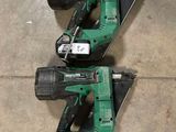 two green power tools sitting on top of a cement floor