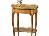 a small table with a vase on top of it