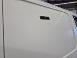 a white van with a sticker on the side of it