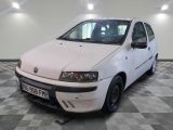 a picture of a white car parked in a garage