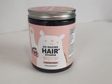an image of a jar of hair butter sitting on a table