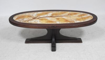 a round coffee table with a marble top and wooden base
