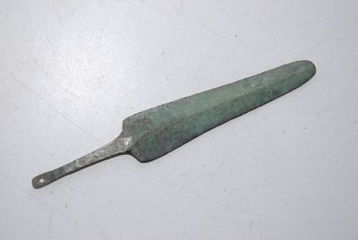 a small knife that is laying on a table