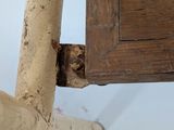 a close up of a piece of wood on a chair