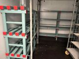 a room with shelves and shelves that have red and blue labels on them