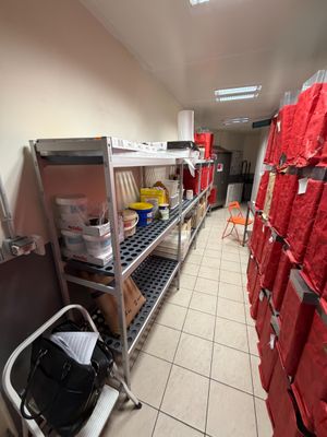 a room filled with lots of red bags and boxes