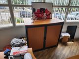 a picture of a room with a lot of clutter on the table