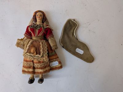 a doll and a knife on a table
