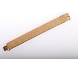 an image of a piece of gold glittered paper on a white surface