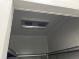 two fans that are hanging from the ceiling in the bathroom