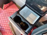 a car seat with a cup holder in it