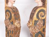 pair of carved wood figures of a man and a woman