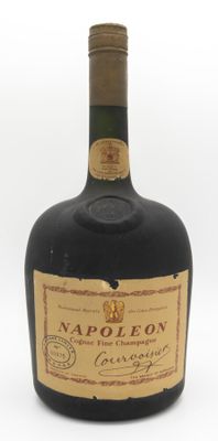 an old bottle of liquor sitting on top of a white surface
