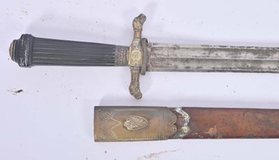 two different types of knives on a white surface
