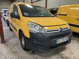 the yellow van is parked in the garage next to other vehicles