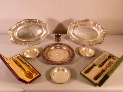 a lot of silverware on a table with a box