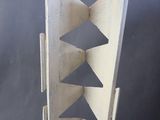 a metal object that looks like a triangular structure