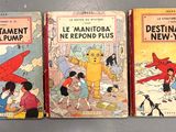 Trois livres pour enfants sont alignés sur une table