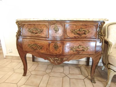 an image of a chest of drawers in a living room