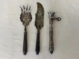 two knives and a knife holder on a table